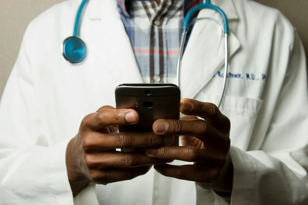 A physician reviewing care information